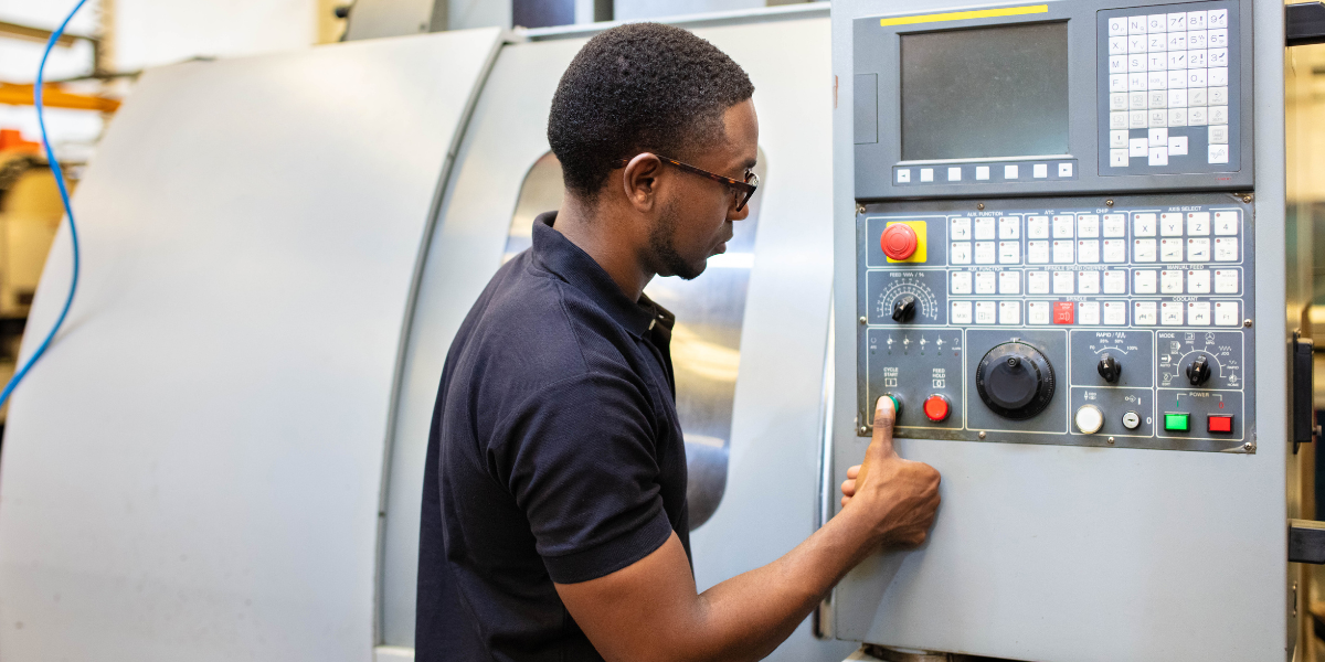 Man operating a CNC machine